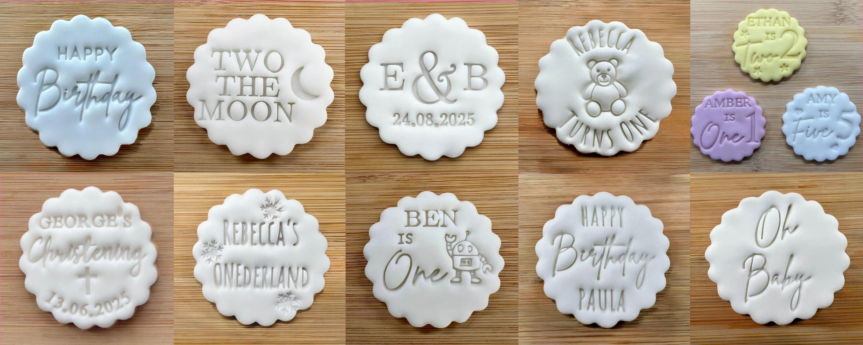 Collection of personalized cookie stamps with various designs and text on a wooden surface.