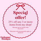 Promotional message for a special offer with a red bow on a pink background, featuring text about discounts from Embosser Boutique.
